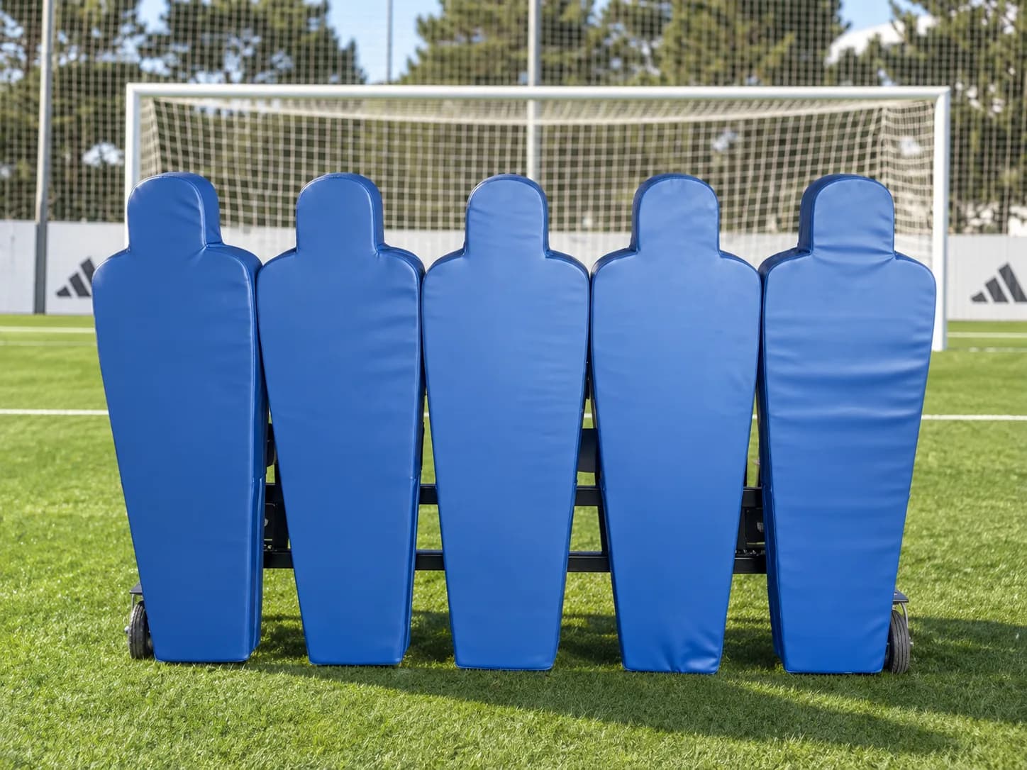 KV Robotic Wall with five blue padded defenders in front of a goal